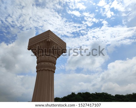beautiful picture of stone pillar and cloudy sky