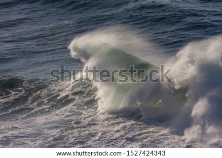 Waves crashing into Atlantic Ocean shore