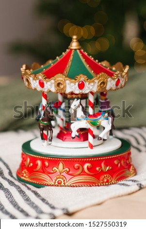 Christmas toy red white green carousel, close-up