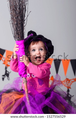 Little girl on Halloween, decor for the holiday. Holidays
