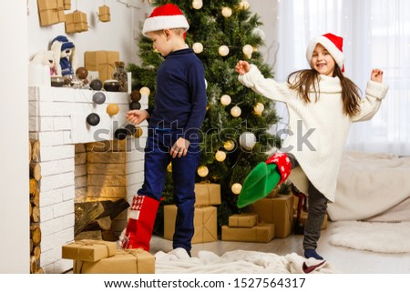 Christmas Kids. Happy Children Opening Gifts. New Year. Christmas Tree