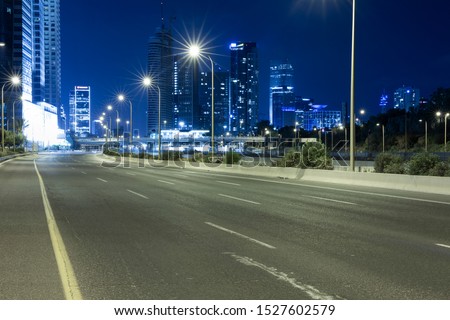 Empty Freeway At Night And Tel Aviv Skyline in Background