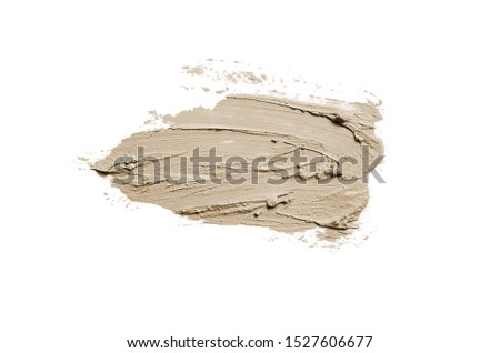 Smear and texture of lipstick or acrylic paint isolated on white background. Stroke of lipgloss or liquid nail polish swatch smudge sample. Element for beauty cosmetic design. Brown color