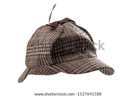 Vintage investigator and retro inspector conceptual idea with deerstalker type hat or Sherlock Holmes cap isolated on white background with clipping path cutout using ghost mannequin technique Royalty-Free Stock Photo #1527641588