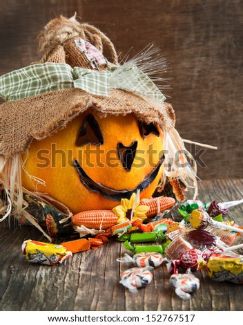 Jack-o-lantern and Halloween candy  