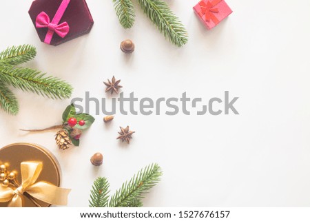 Holiday Christmas card background with festive decoration ball, stars, snowflakes, gift box, pine cones on a white background from Flat lay, top view. Space for text Merry Christmas and happy New Year