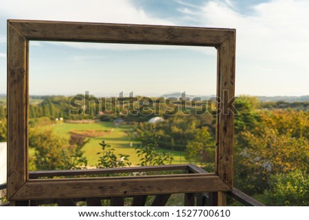 Beautiful landscape view in antique wood picture frame.