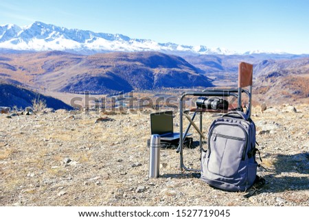 Photographer and Blogger Equipment in outdoor. Hiking Adventure Blogger Travel Concept.