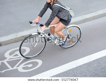 Top view of motion blurred bicyclist in bike lane Royalty-Free Stock Photo #152776067