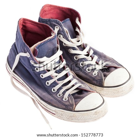 pair of blue sneakers on a white background