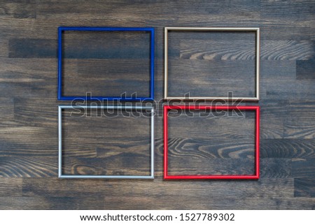 Multiple many blank small picture frames on wooden wall. For photo frames on wooden background. Copy space