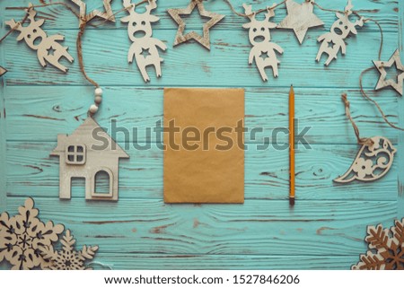 Christmas greeting card. Festive decoration on wood turquoise background. New Year concept. Copy space. Flat lay. Top view.