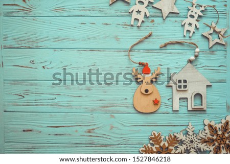 Christmas decoration on wood turquoise background. New Year concept. Copy space. Flat lay. Top view.