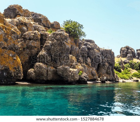 Panoramic rock island view on amazing bay. Ionian Sea blue water in Greece.