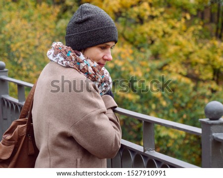 Beautiful brunette woman in autumn yellow park