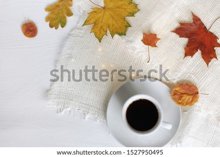 cup of black coffee on the festive table top view. little break on autumn weekend