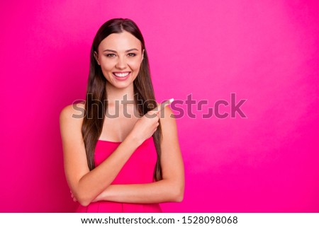 Photo of amazing lady indicating fingers empty space showing low price novelty wear bright stylish cute dress isolated vibrant pink color background