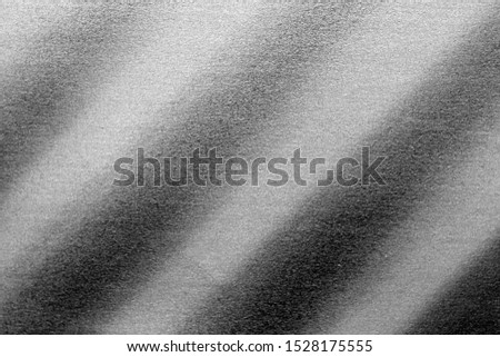Plastic glittering texture in black and white. Abstract architectural background and texture for design.
