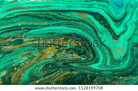 Green and gold marbling ripple of agate. Royalty-Free Stock Photo #1528199708