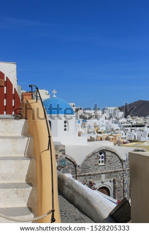 Greece santorini view with blue dome church and scale. Mediterranean white and blue summer landscape.