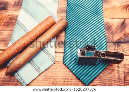 necktie for real men. Modern formal style. male tie and cigar. Male shop. vintage. retro style. Cigar and lighter. Wedding elegant accessory. Fashion look. Business detail. mens club.