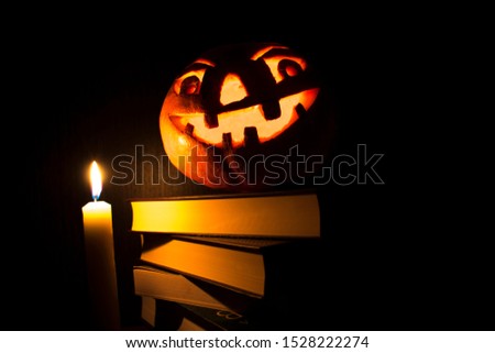 Halloween.  pumpkin head and books
