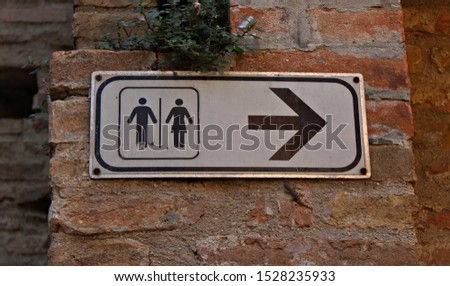 Italy: Road signal (Direction pointer to toilet).