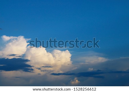 Beautiful sky with white fluffy cloud