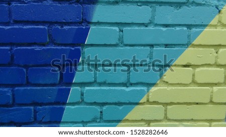 brick wall painted in different bright colors
