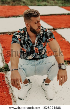 Portrait beauty man with beard on red white background