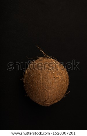 Coconut. Coconut isolated on black background. Full depth of field. Macro Photo food fruit coconut. Texture tropical fruit coconut nut. Image fruit coconuts.