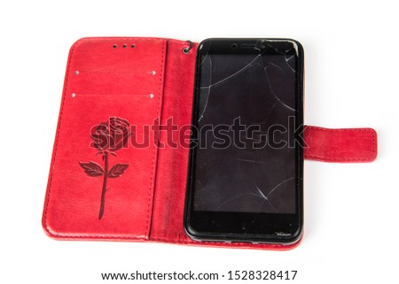 Broken smartphone protection glass on a white background
