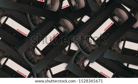 Video tape on colored background, VHS, cassette	 Royalty-Free Stock Photo #1528365671
