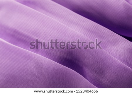 texture of the satin fabric of lilac color for the background
