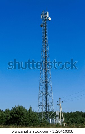 Metal tower with mobile communication antennas.