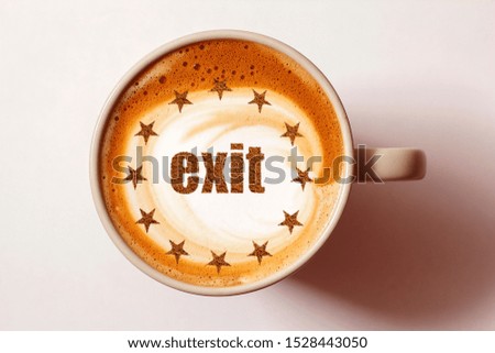 A cup of cappuccino coffee with the symbol of the Eurozone and the inscription EXIT