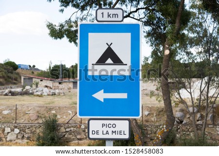 Spanish traffic sign: camping 1km away to the left. (Peak of Honey)