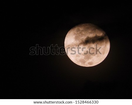 The moon and the clouds on a dark night