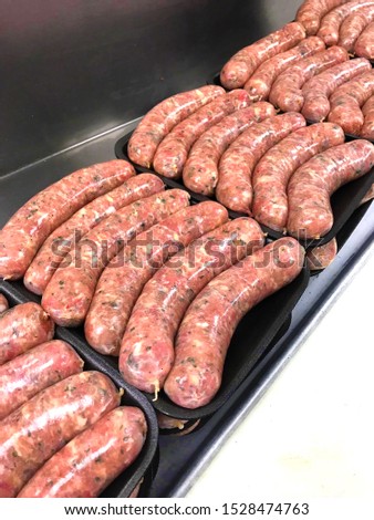 Rows of Raw Chicken Sausage with Jalapenos, Sausages on a plate for cooking dinner food