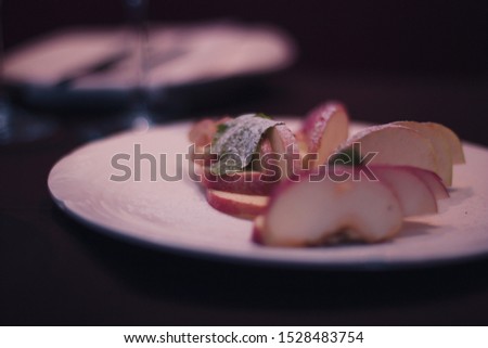 Sliced apples on a plate. A restaurant