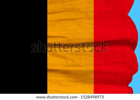 photograph of the beautiful colored national flag of the modern state of Germany on textured fabric, concept of tourism, economics and politics