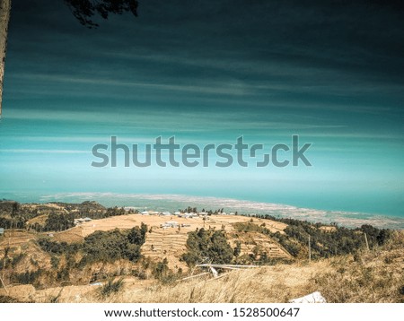 Beautiful natural scenery in the photo above the mountain edited with a cool teal tone.