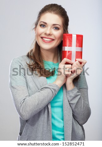 Portrait of young happy smiling woman hold gift box.Smiling girl. Isolated studio background female model.