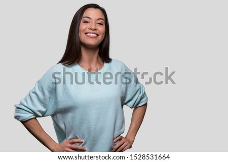 Proud and accomplished young woman smiling with pride, confidence, high self esteem, empowered confident leader student Royalty-Free Stock Photo #1528531664