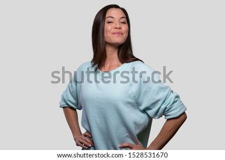 Woman standing with proud posture, self confidence, high self esteem, accomplished, courageous expression, female youth empowerment Royalty-Free Stock Photo #1528531670