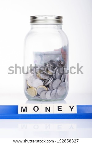Money in the bottle MONEY alphabet letters. Saving concept