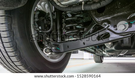 Technical photo. The structure of the modern car. Rear suspension. Shock absorber. Spring suspension. Royalty-Free Stock Photo #1528590164
