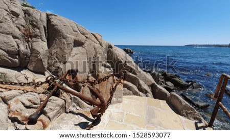 Old Anchor and chain on the cliff