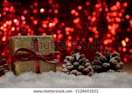  beautiful Christmas photo with twigs of spruce, Christmas toys on the background of falling snow