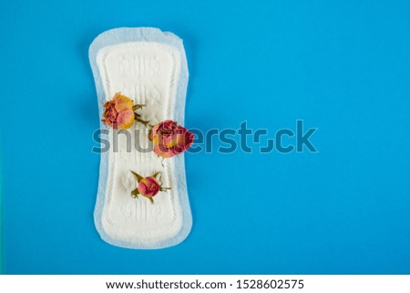 Hygiene pad with pink rose. Close up